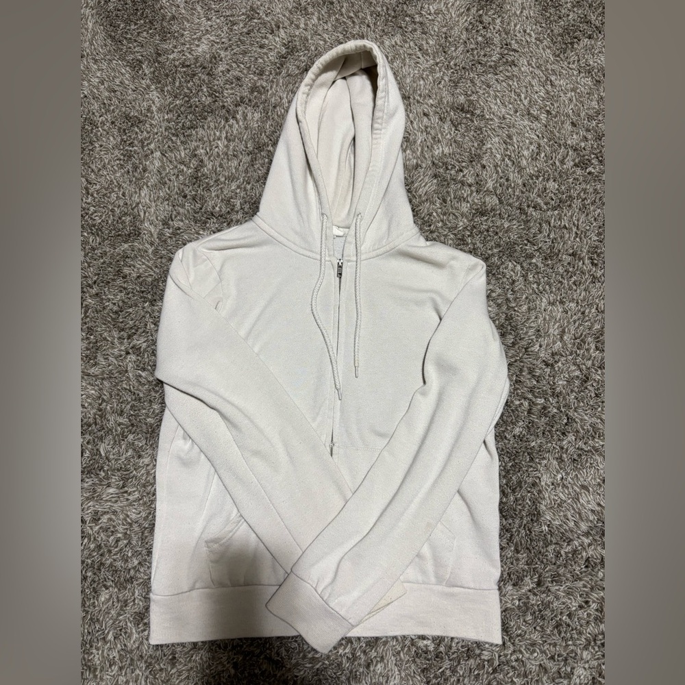 Reflex, white, medium in men’s but runs small